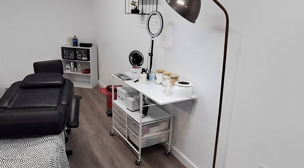 Cozy treatment room at Mav & Harp Co Salon, Selinsgrove, Pennsylvania, US, featuring a massage table and equipment.
