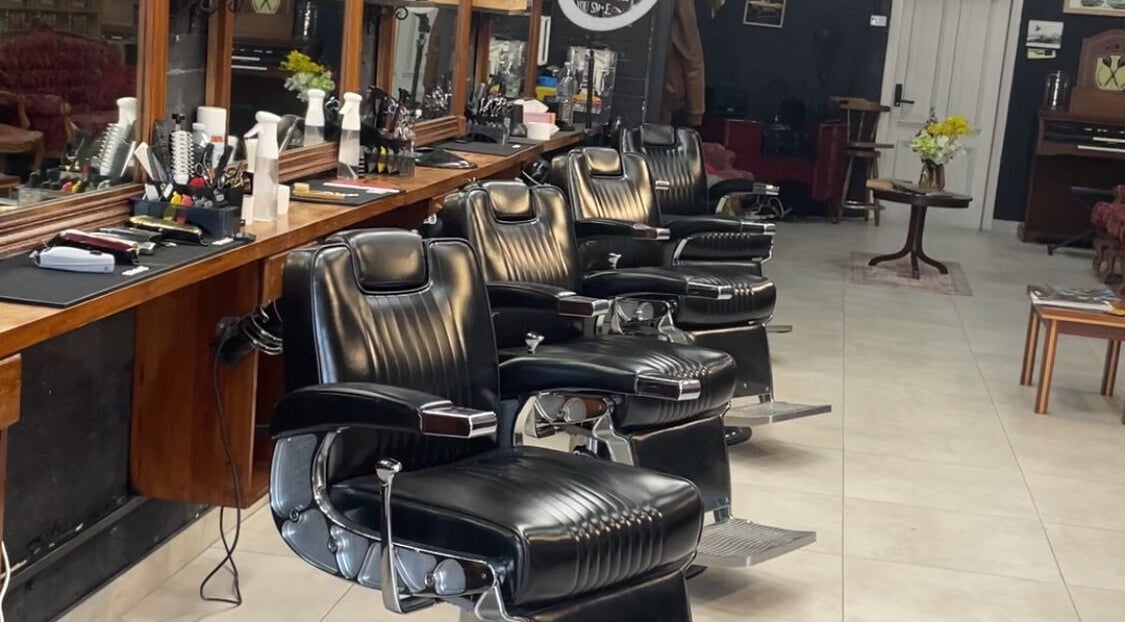 Classic barber chairs at The Barbershop Cafe, Melbourne, Victoria, AU, showcasing a vintage interior style.