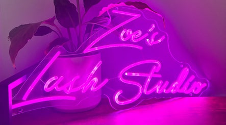 Vibrant neon sign of Zoe’s Lash Studio in St Albans Park, Victoria, AU with pink lighting.