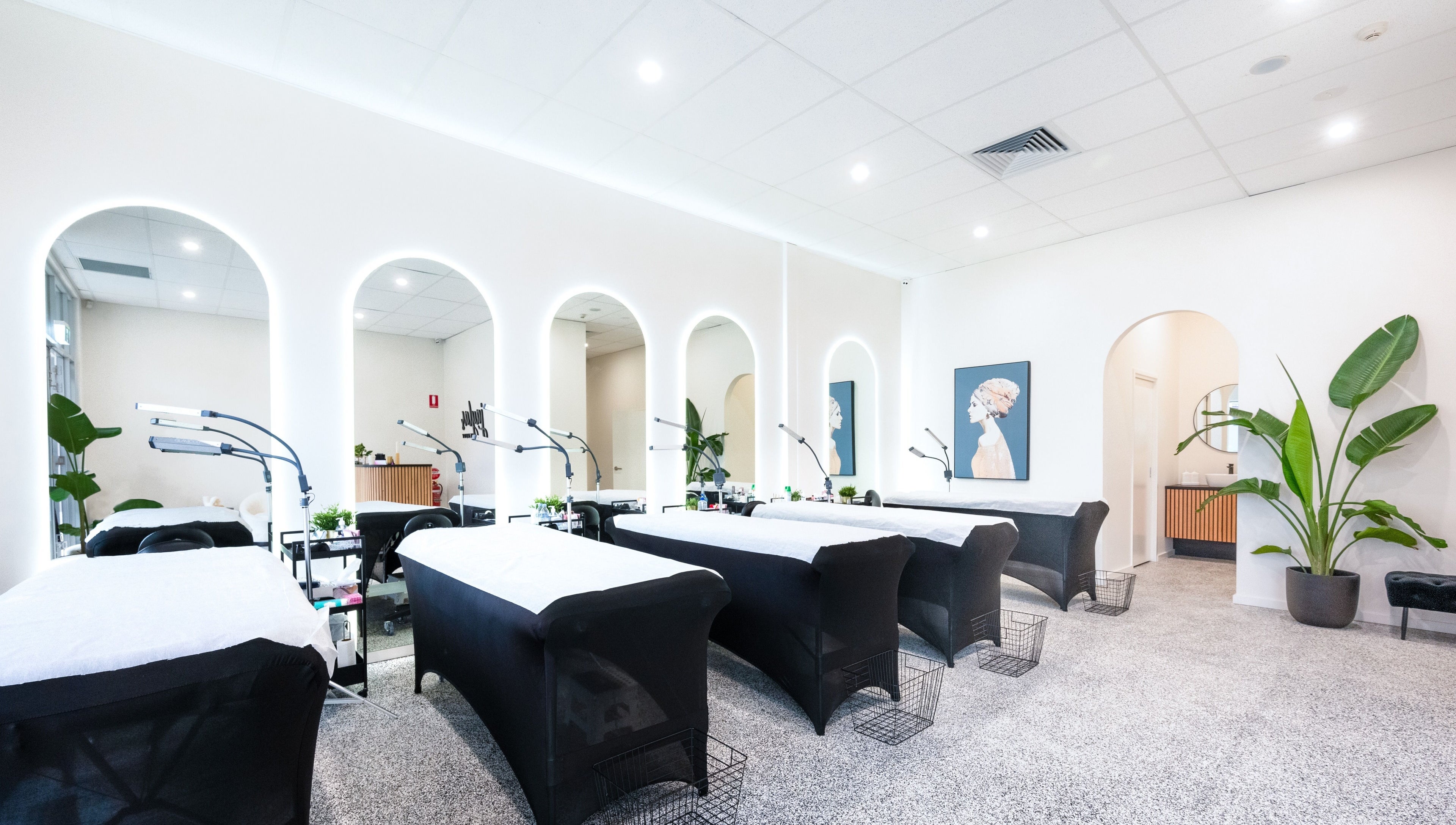 Bright treatment room at Jayla's Beauty Salon in Melbourne, Victoria, AU featuring modern decor and cozy beds.