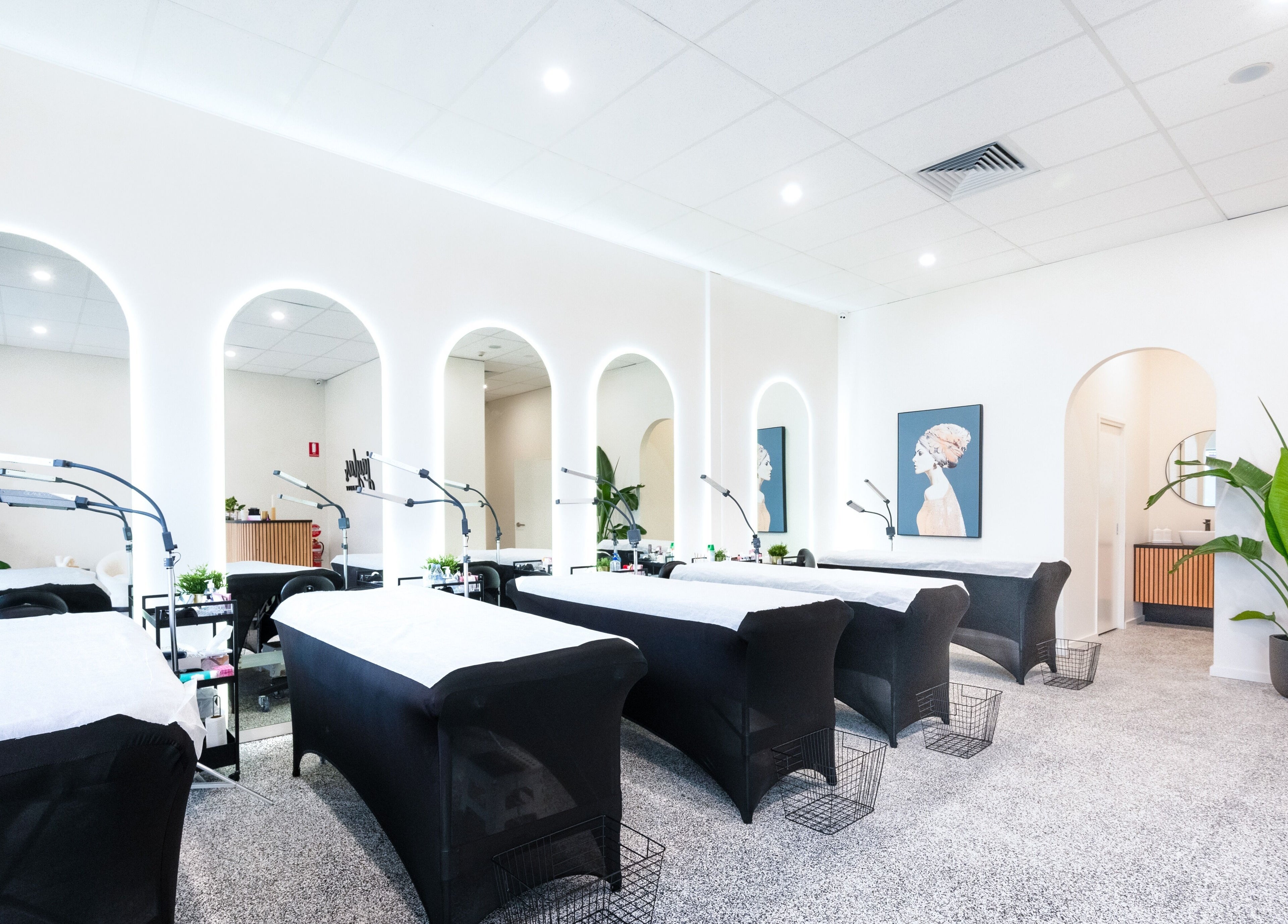 Bright treatment room at Jayla's Beauty Salon in Melbourne, Victoria, AU featuring modern decor and cozy beds.