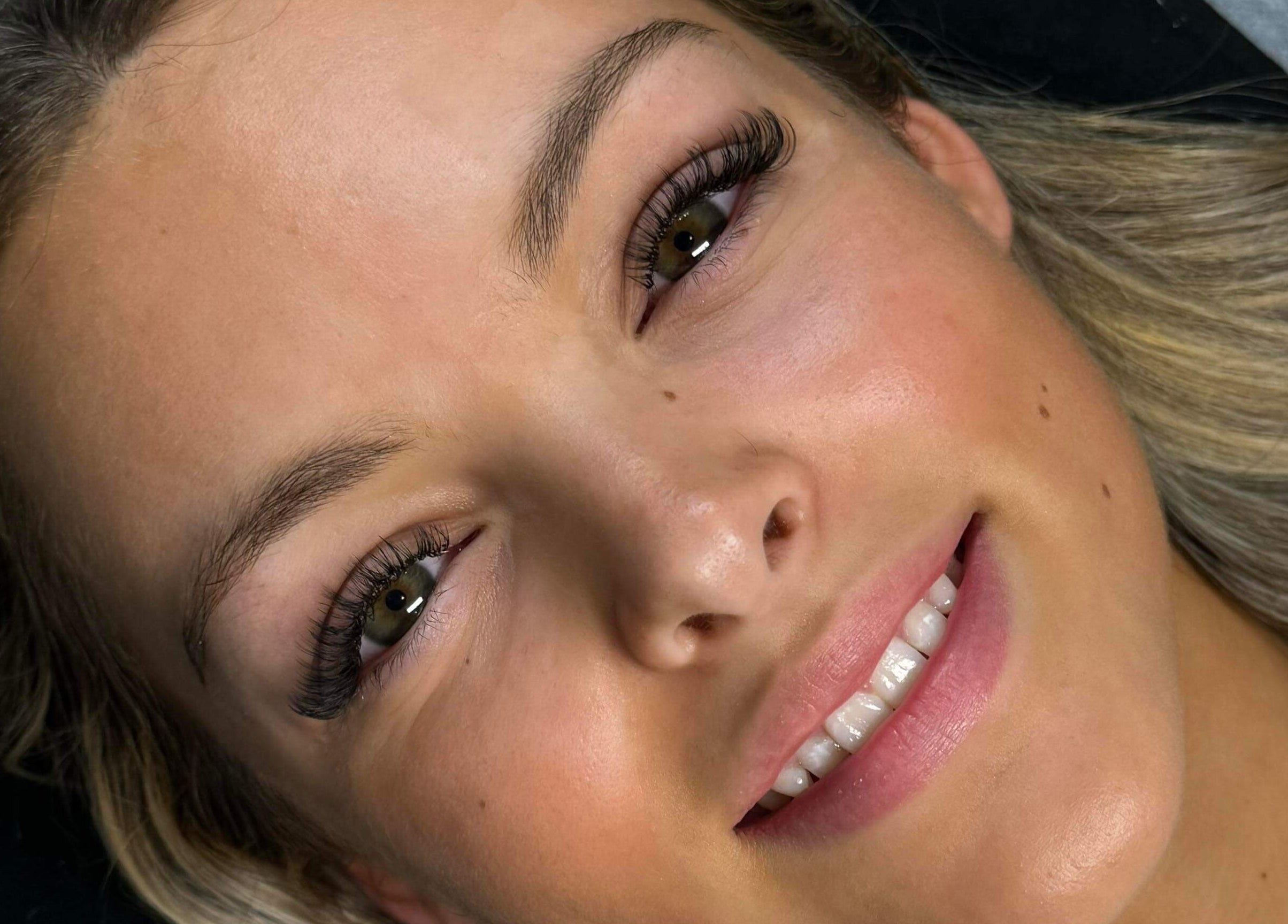 Smiling woman with beautiful lashes at Jayla's Beauty Salon, Melbourne, Victoria, AU.