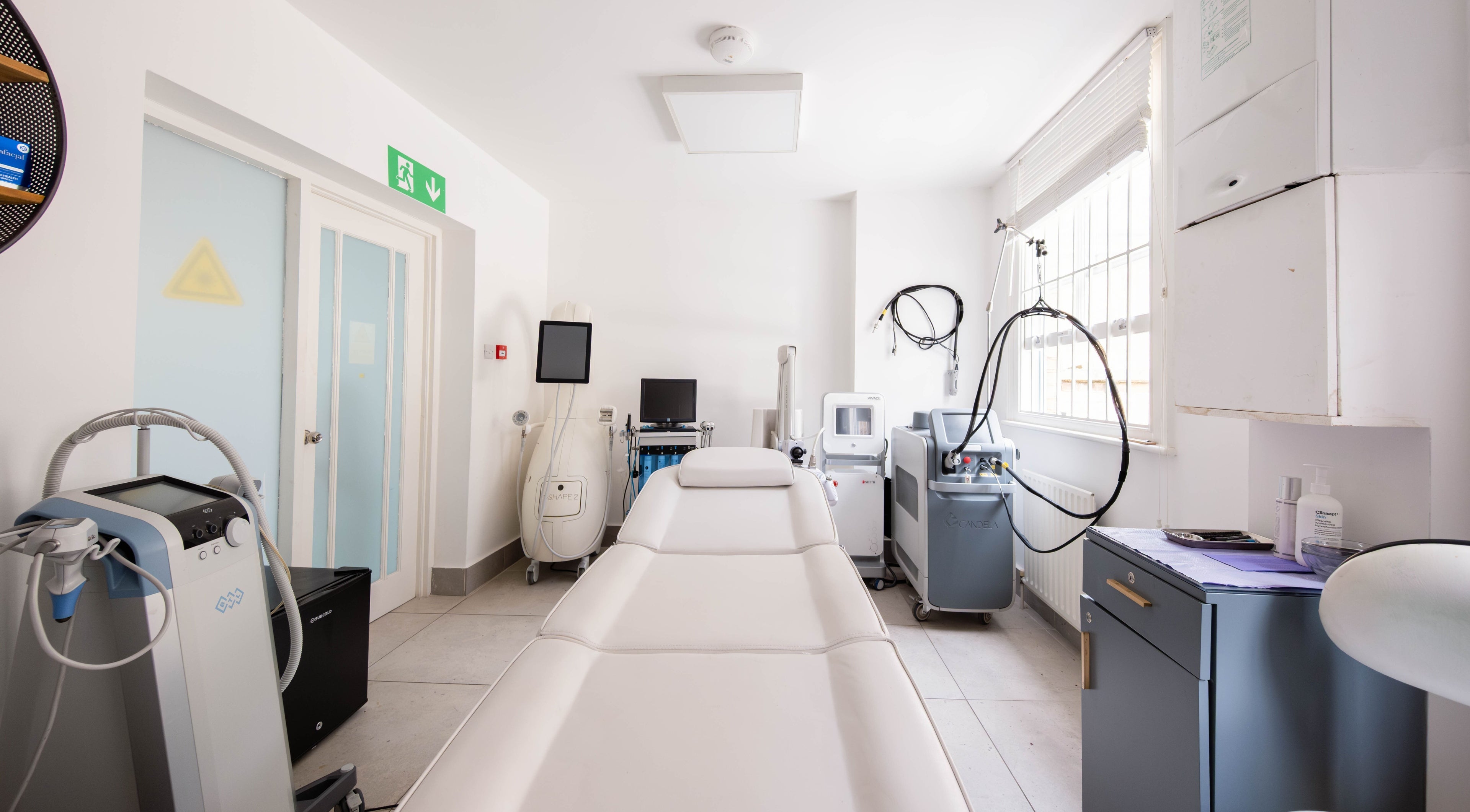 Sleek treatment room at Skin Life Laser and Aesthetic Clinic, London, England, GB showcasing advanced equipment.