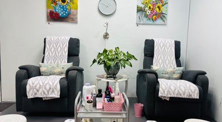 Relaxing seating area at Nails by Anjonet in George, Western Cape, ZA with comfy chairs and decor.