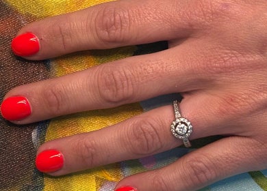 Vibrant red nails with a diamond ring at Nails by Anjonet, George, Western Cape, ZA.