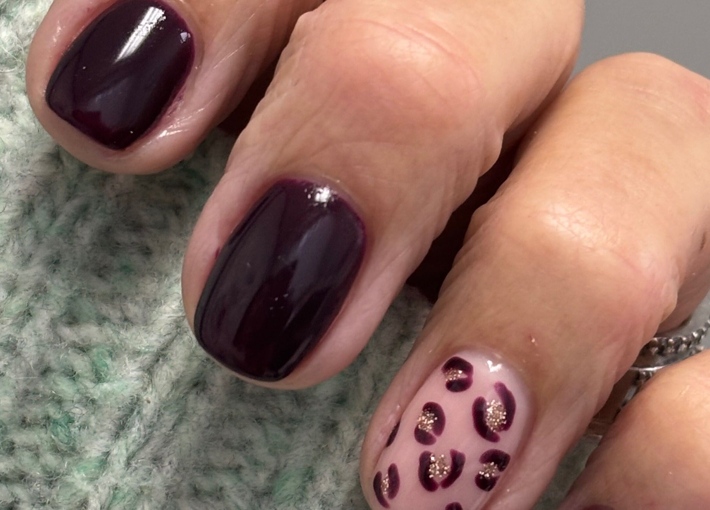 Elegant plum and leopard nail design at Nails by Anjonet, George, Western Cape, ZA.
