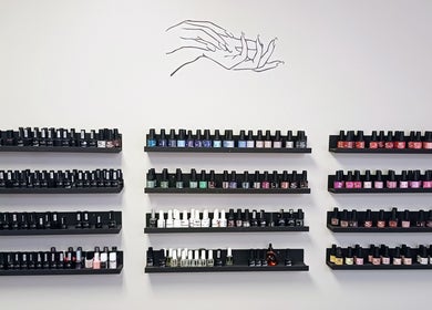 Vibrant nail polish shelves at Beauty by Nadia, Pretoria, Gauteng, ZA showcasing an array of colors.