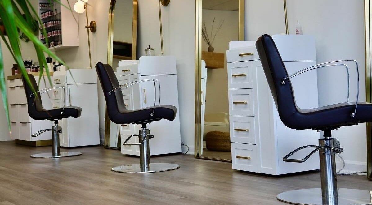 Modern salon interior with sleek chairs at Roots Radicals North, Brewster, New York, US.