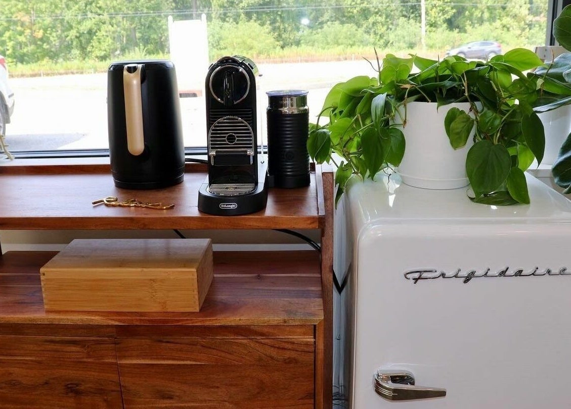Coffee station with plants at Roots Radicals North in Brewster, New York, US, offering a cozy ambiance.
