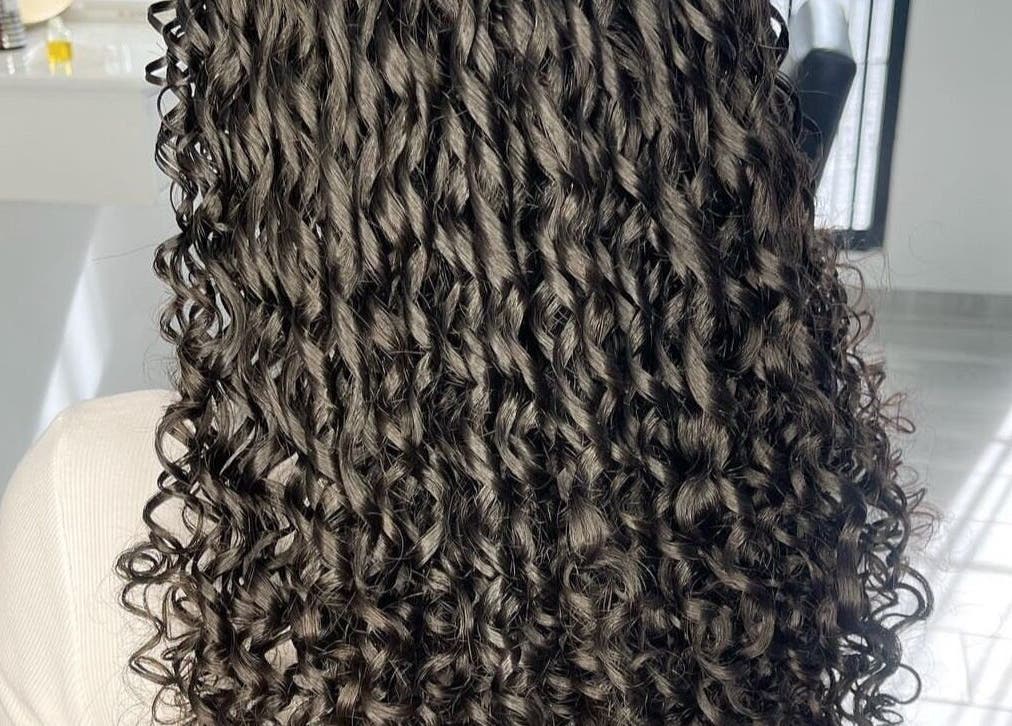 Stylish curly hairstyle at Curl Babes in Paramaribo, Paramaribo, SR.