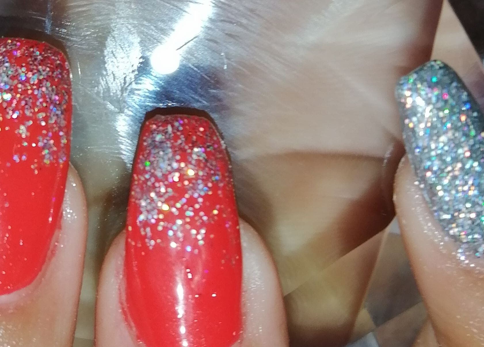Glittery red and silver nails at Nailed It Nerize in Pretoria, Gauteng, ZA.