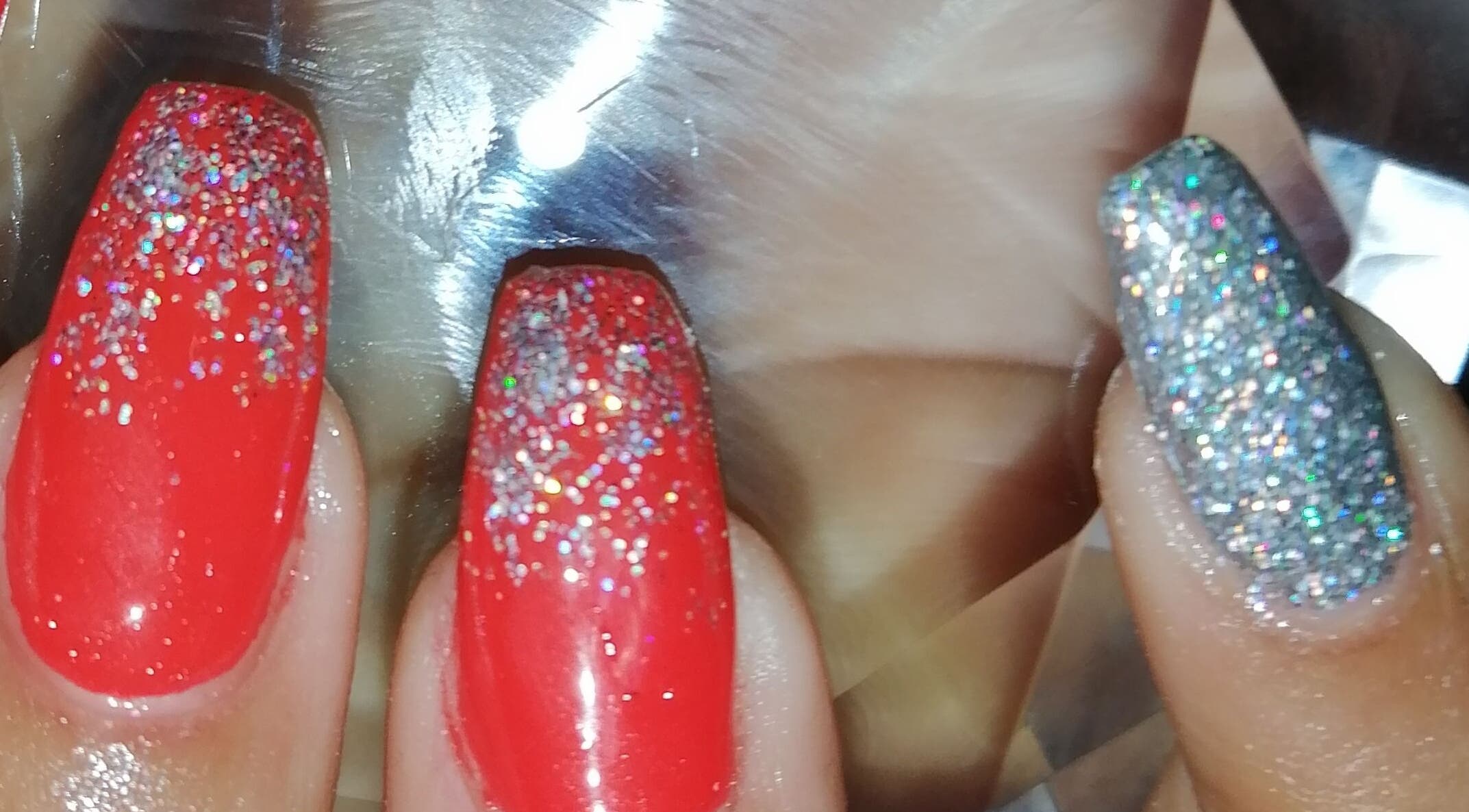Glittery red and silver nails at Nailed It Nerize in Pretoria, Gauteng, ZA.