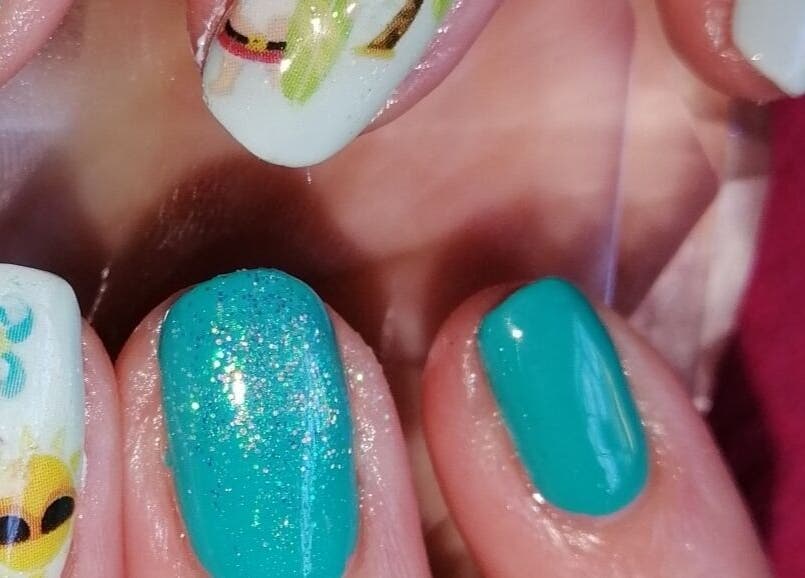 Bright turquoise nails with fun designs at Nailed It Nerize, Pretoria, Gauteng, ZA.