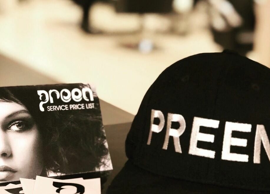 Preen's price list and branded cap at Melbourne, Victoria, AU beauty venue.