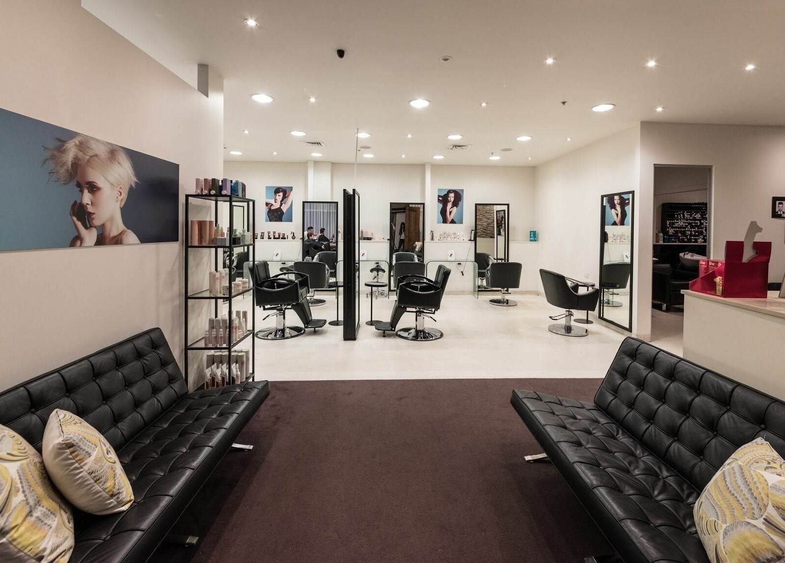 Modern salon interior at Preen in Melbourne, Victoria, AU with sleek black chairs and stylish decor.