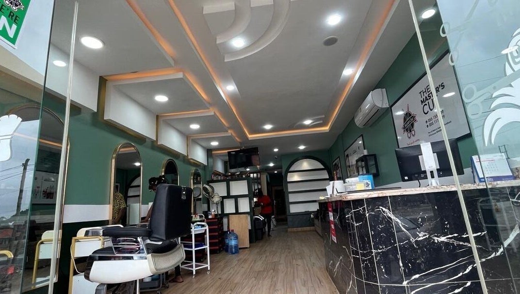 Modern interior of The Masters Cut Spintex in Accra, Greater Accra Region, GH with elegant salon chairs and decor.