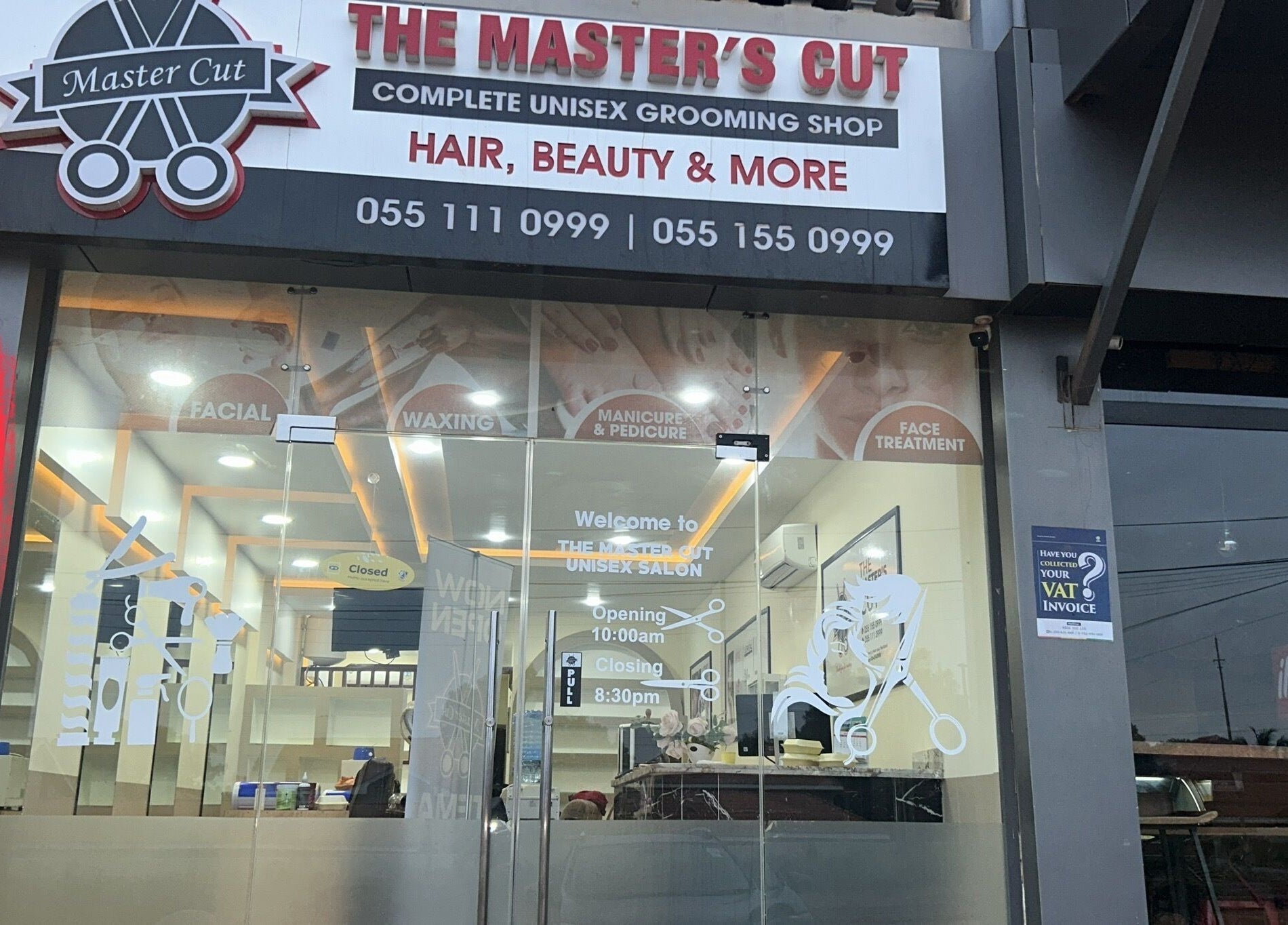 Front view of The Masters Cut Spintex salon in Accra, Greater Accra Region, GH showcasing glass doors and signage.