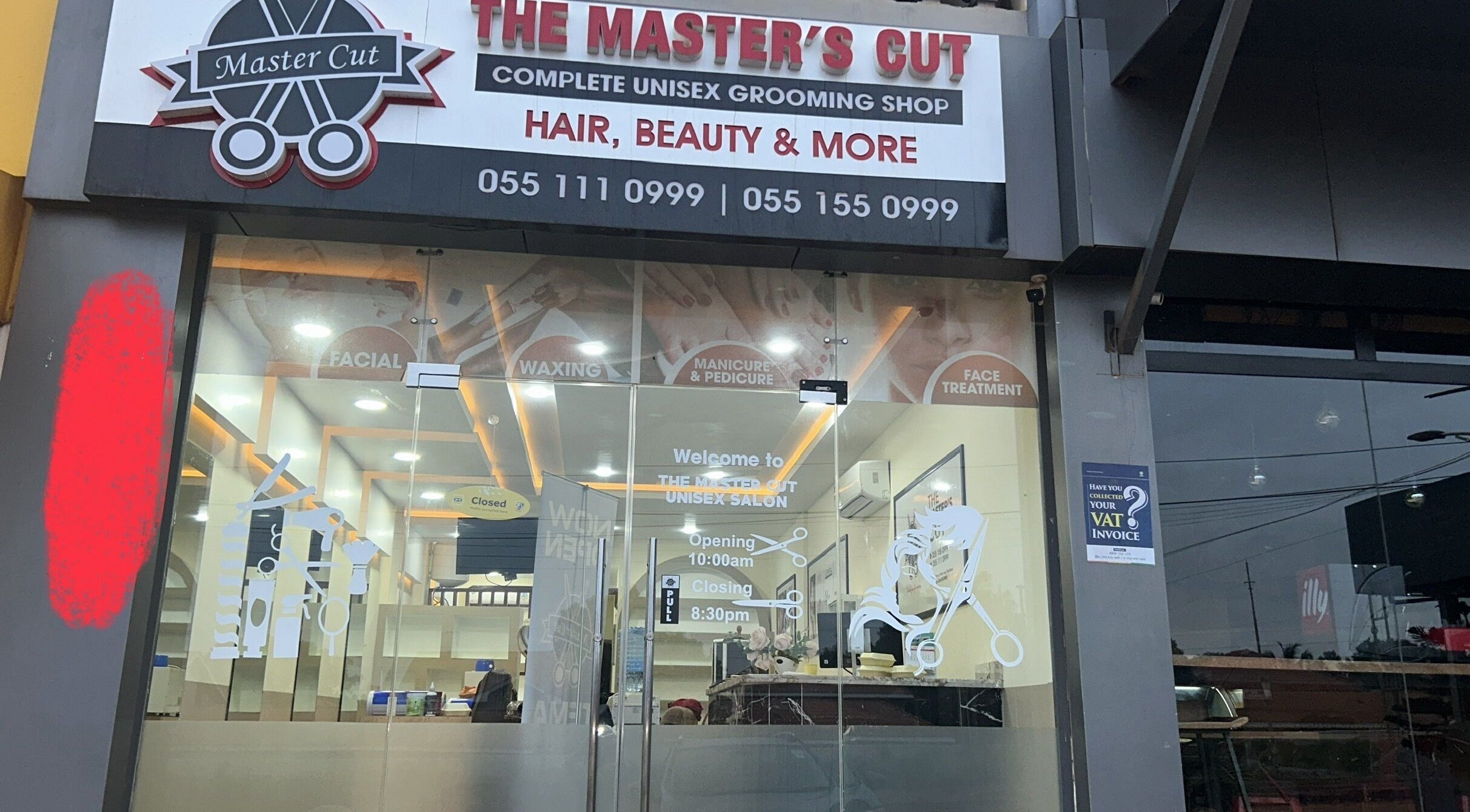 Front view of The Masters Cut Spintex salon in Accra, Greater Accra Region, GH showcasing glass doors and signage.
