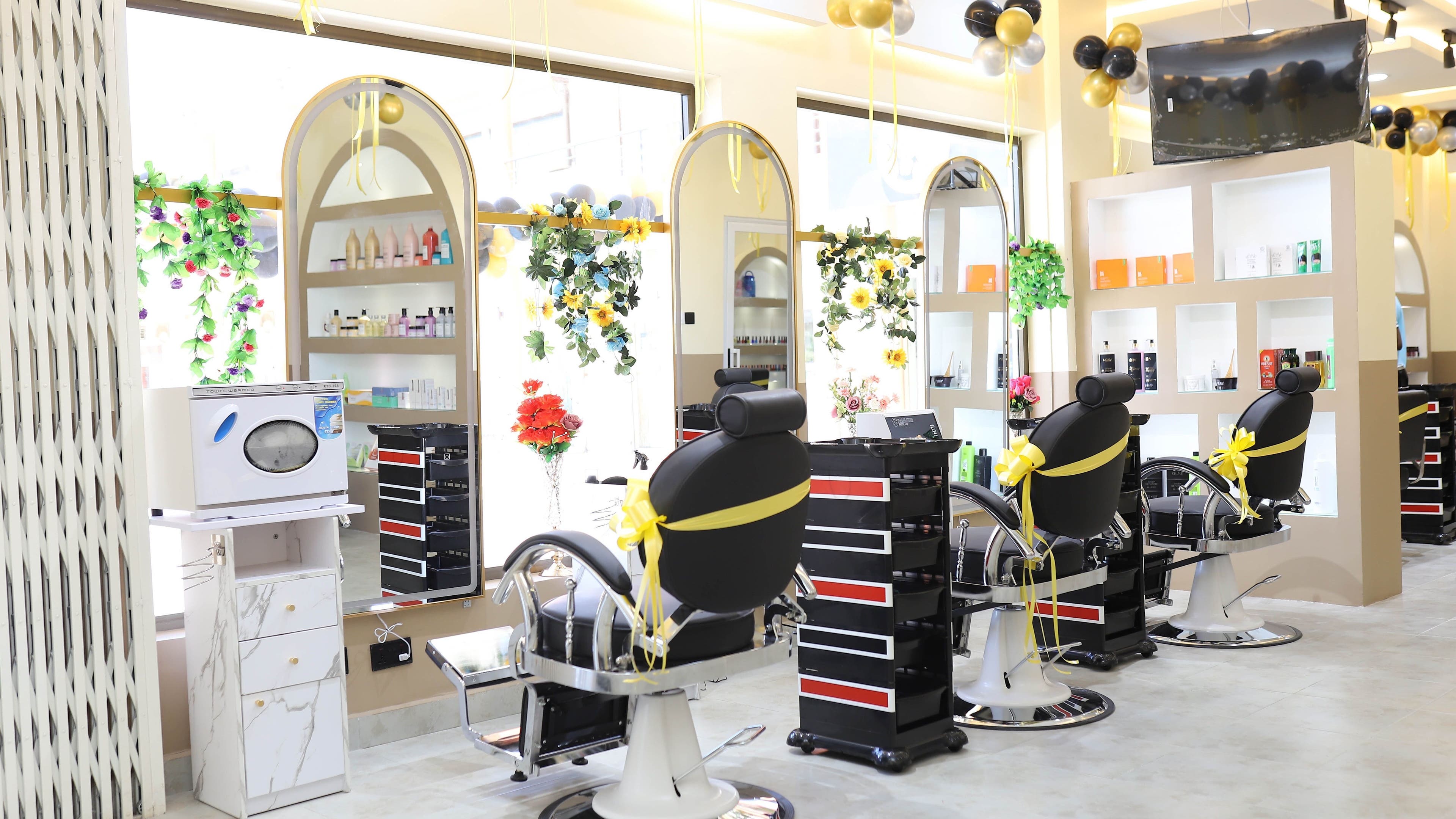 Stylish interior of The Masters Cut Tema in Tema, Greater Accra Region, GH featuring elegant salon chairs and decor.