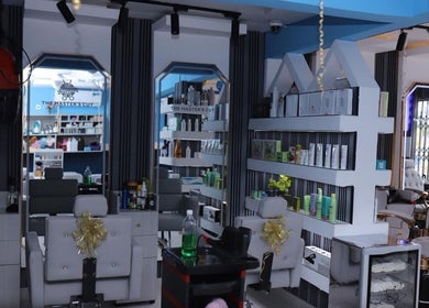 Interior of The Masters Cut North Kaneshie salon featuring modern styling chairs. Located in Accra, Greater Accra Region, GH.