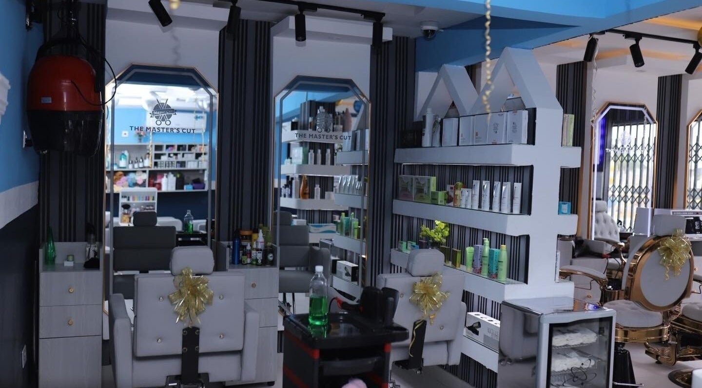 Interior of The Masters Cut North Kaneshie salon featuring modern styling chairs. Located in Accra, Greater Accra Region, GH.