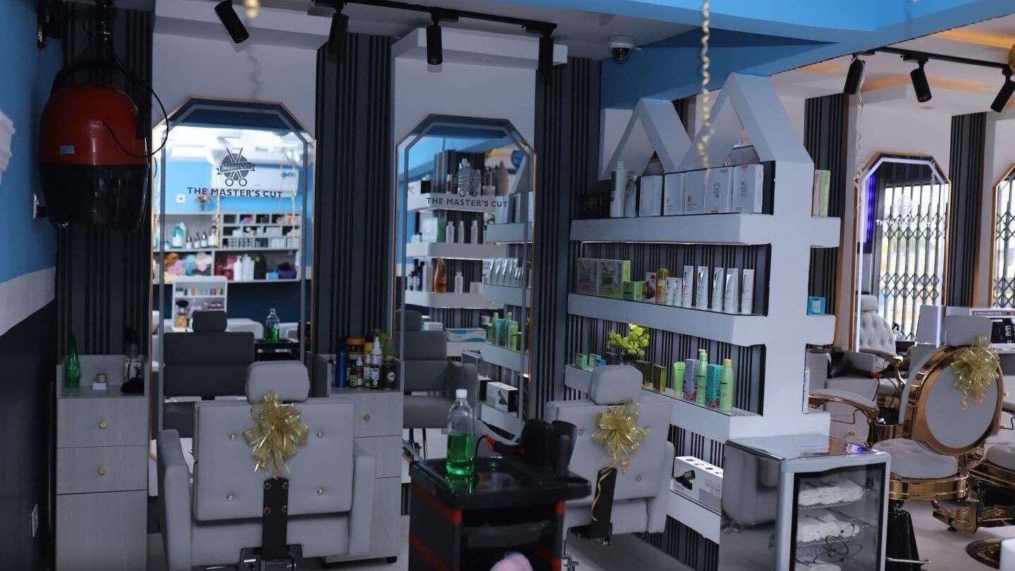 Interior of The Masters Cut North Kaneshie salon featuring modern styling chairs. Located in Accra, Greater Accra Region, GH.