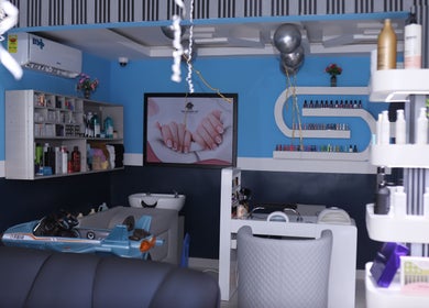 Relaxing interior of The Masters Cut North Kaneshie, Accra, showcasing elegant decor and products.