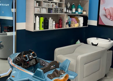 Kids' styling station at The Masters Cut North Kaneshie in Accra, Greater Accra Region, GH.