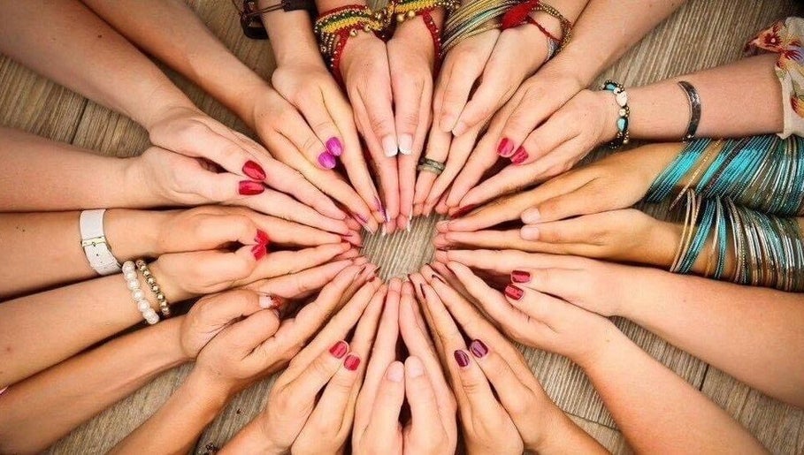 Diverse hands in a circle at ZEN DEN, Wishaw, Scotland, GB.