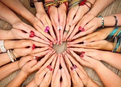 Diverse hands in a circle at ZEN DEN, Wishaw, Scotland, GB.
