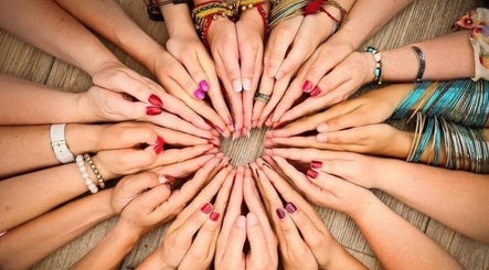 Diverse hands in a circle at ZEN DEN, Wishaw, Scotland, GB.