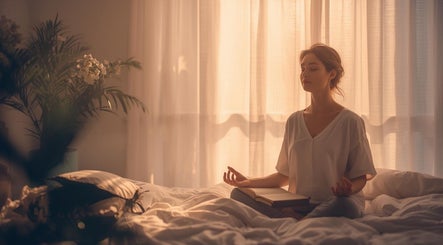 A woman meditating peacefully in the calming ambiance of ZEN DEN, Wishaw, Scotland, GB.