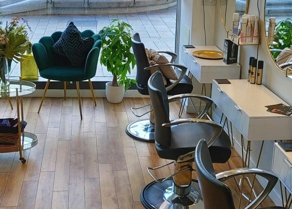 Mark Mardell salon interior with chic decor and styling chairs in Dartford, England, GB.