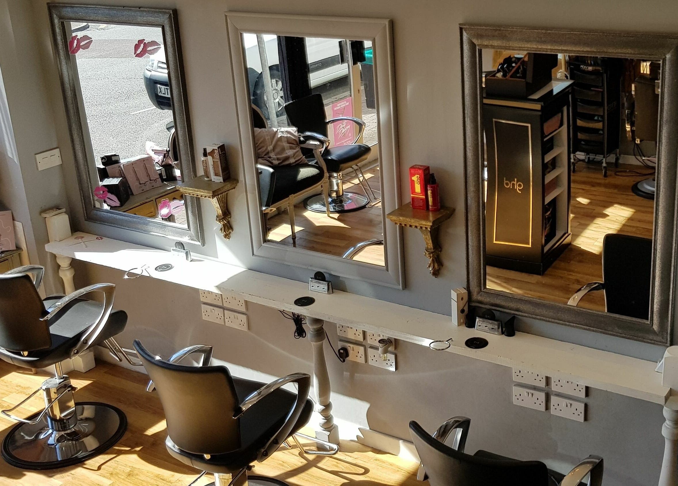 Stylish hair salon chairs and mirrors at Mark Mardell, Dartford, England, GB.