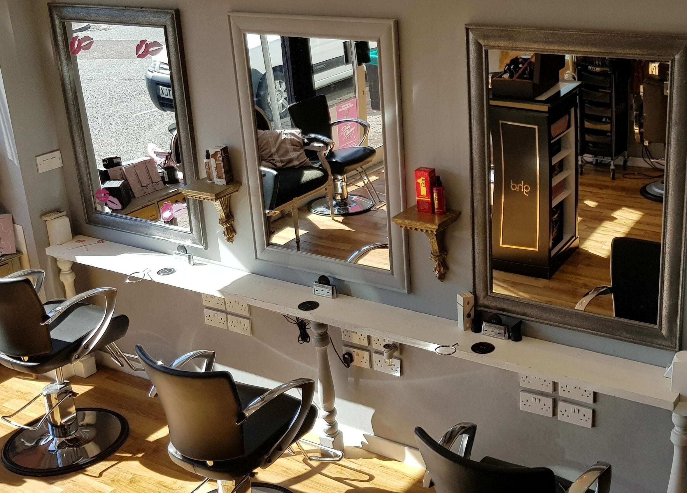 Stylish hair salon chairs and mirrors at Mark Mardell, Dartford, England, GB.