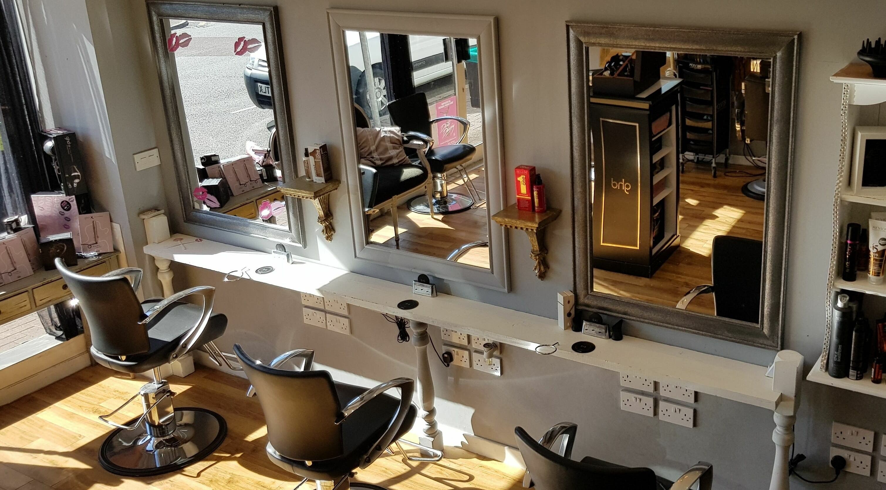 Stylish hair salon chairs and mirrors at Mark Mardell, Dartford, England, GB.