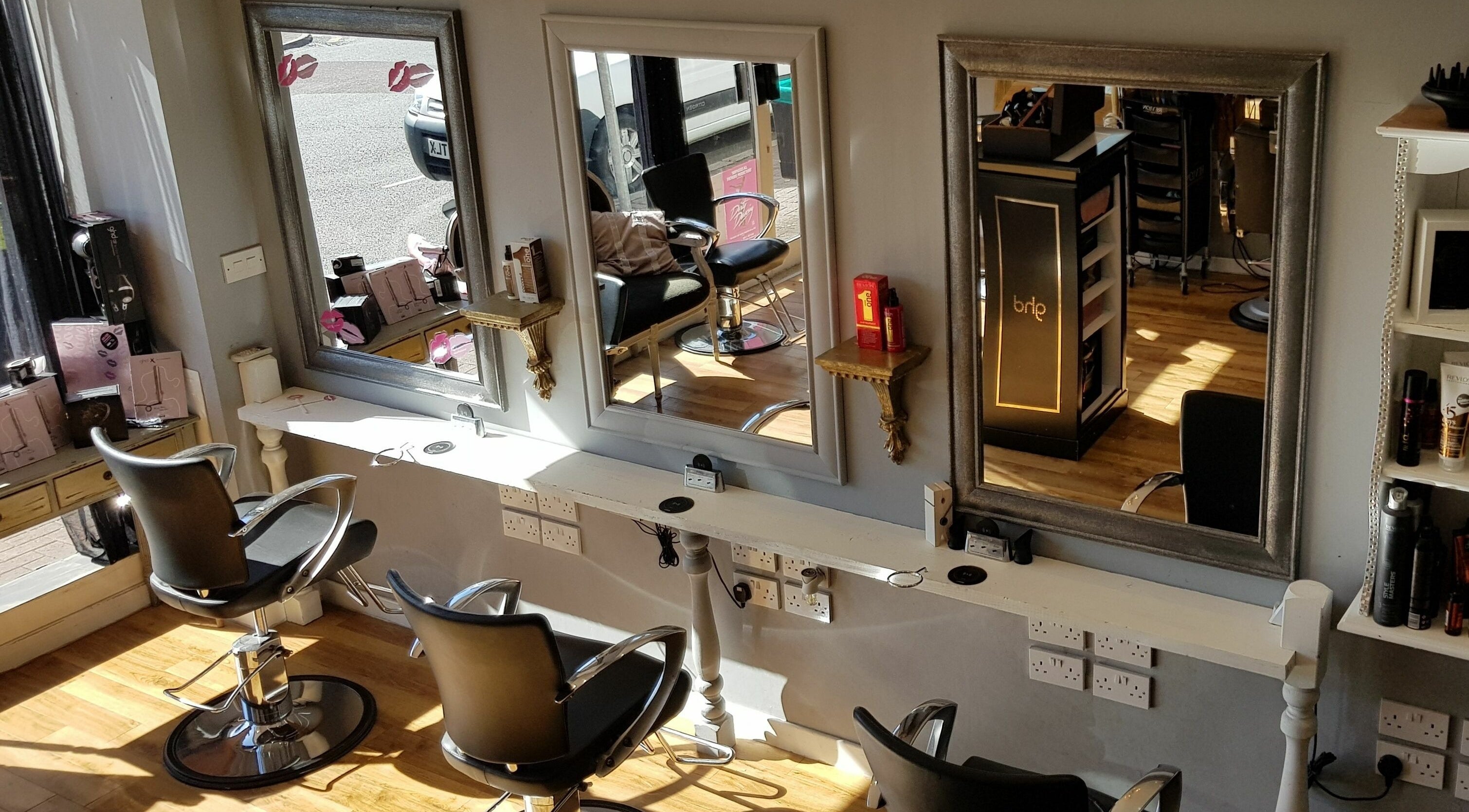 Stylish hair salon chairs and mirrors at Mark Mardell, Dartford, England, GB.