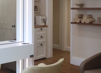 Relaxing beauty suite at Athena by Sophia Olivia, Alderley Edge, England, GB, with cozy chairs and elegant decor.