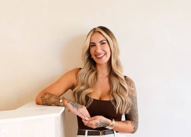 Host at Athena by Sophia Olivia in Alderley Edge, England, GB, smiling in welcoming environment.