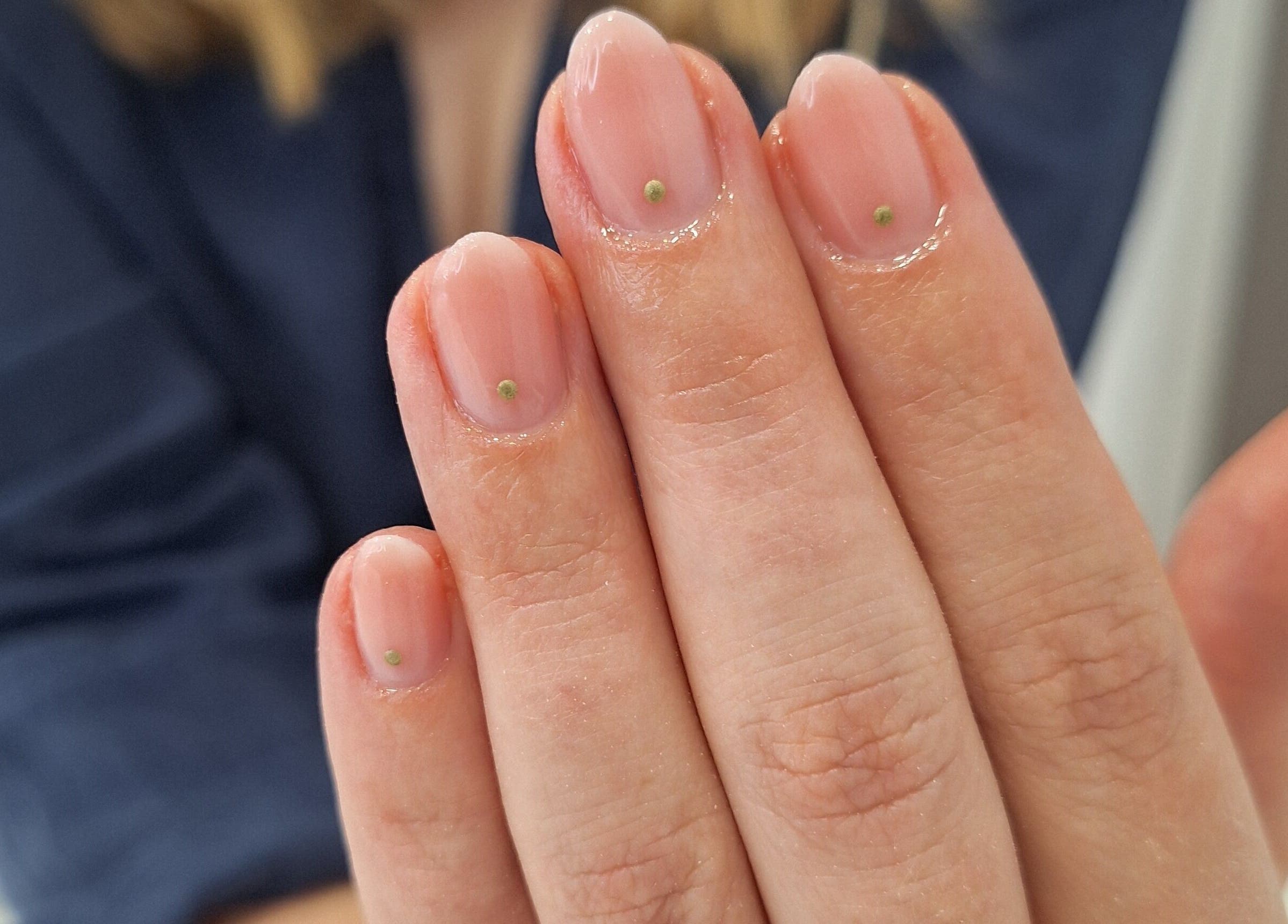 Close-up of manicured nails with subtle dots at Nails Quoture, Glasgow, Scotland, GB.