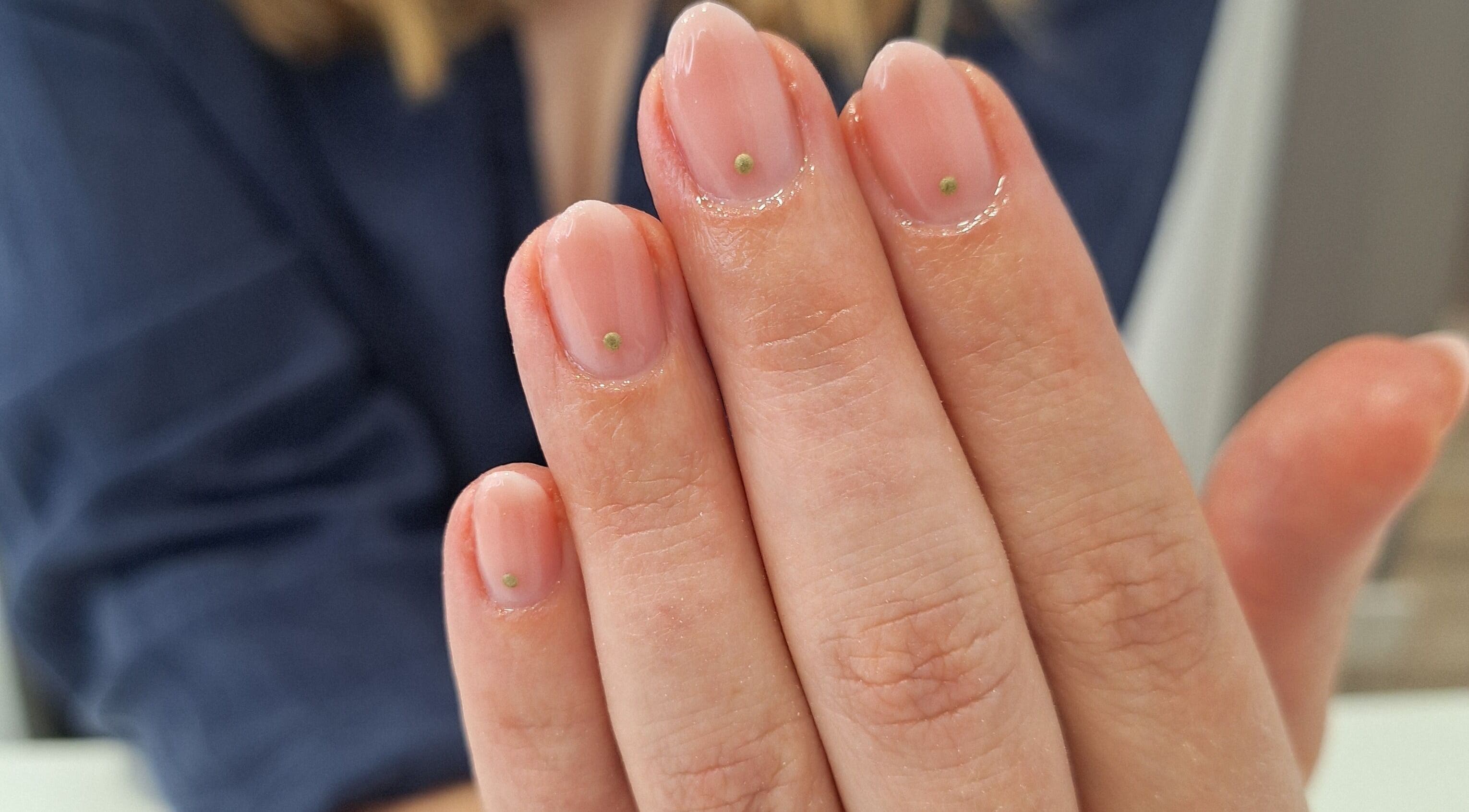 Close-up of manicured nails with subtle dots at Nails Quoture, Glasgow, Scotland, GB.