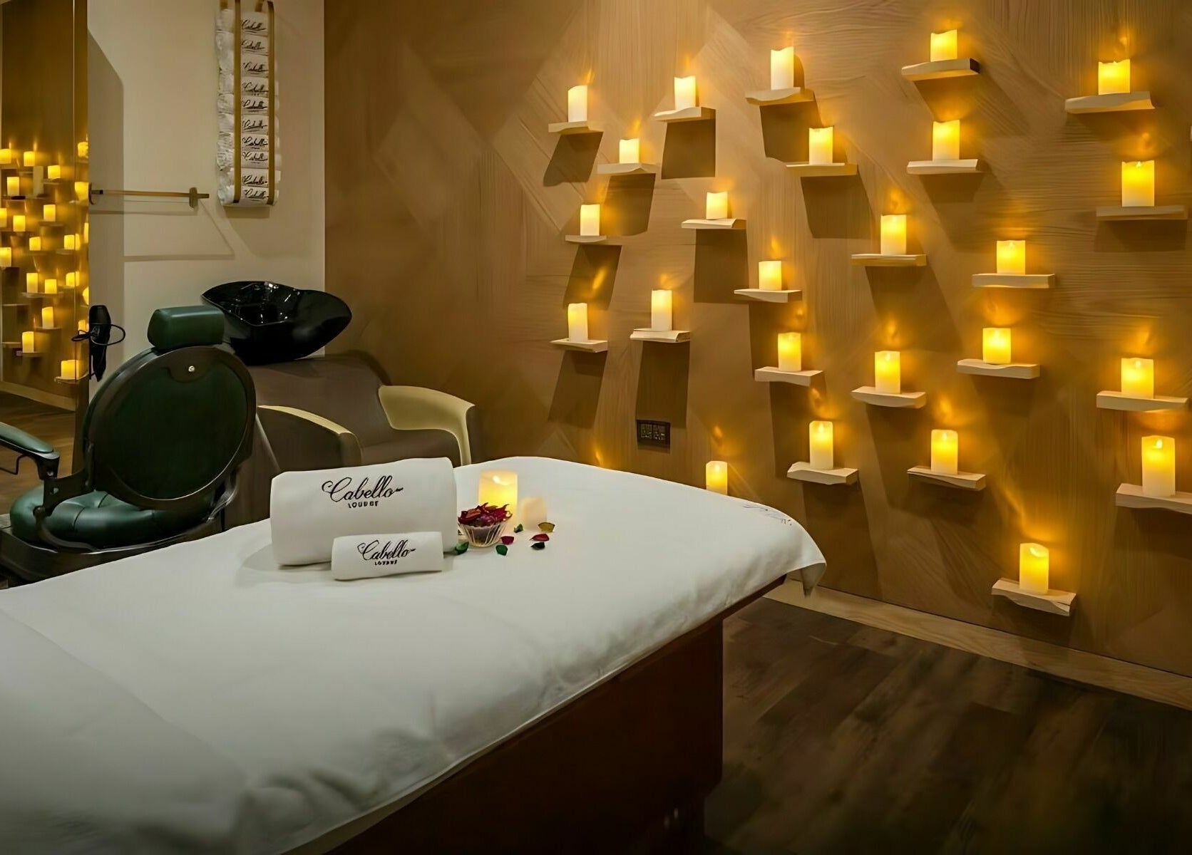 Peaceful spa room at Cabello Lounge - Jumeirah Park in Dubai, featuring ambient candle lighting.