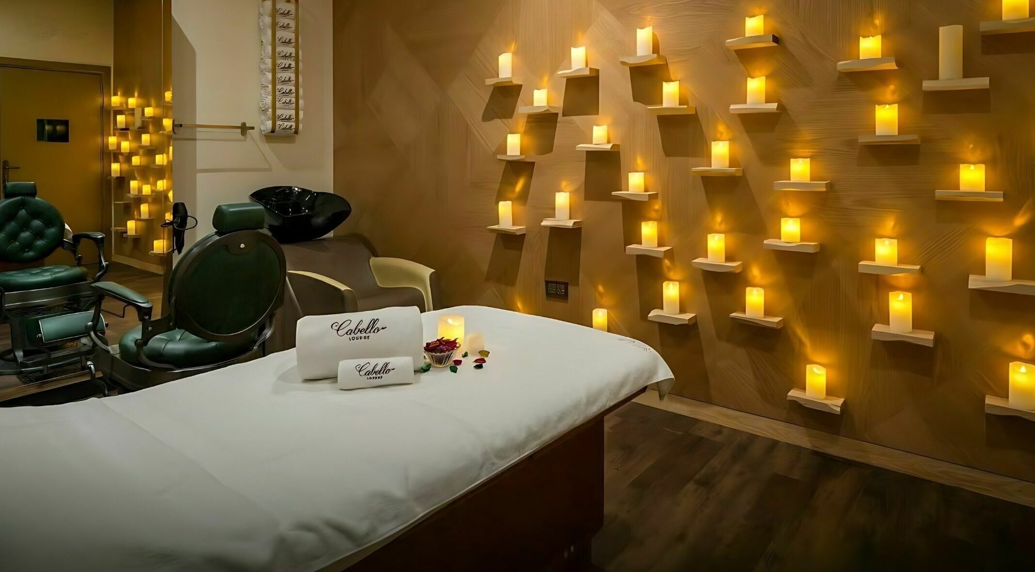 Peaceful spa room at Cabello Lounge - Jumeirah Park in Dubai, featuring ambient candle lighting.