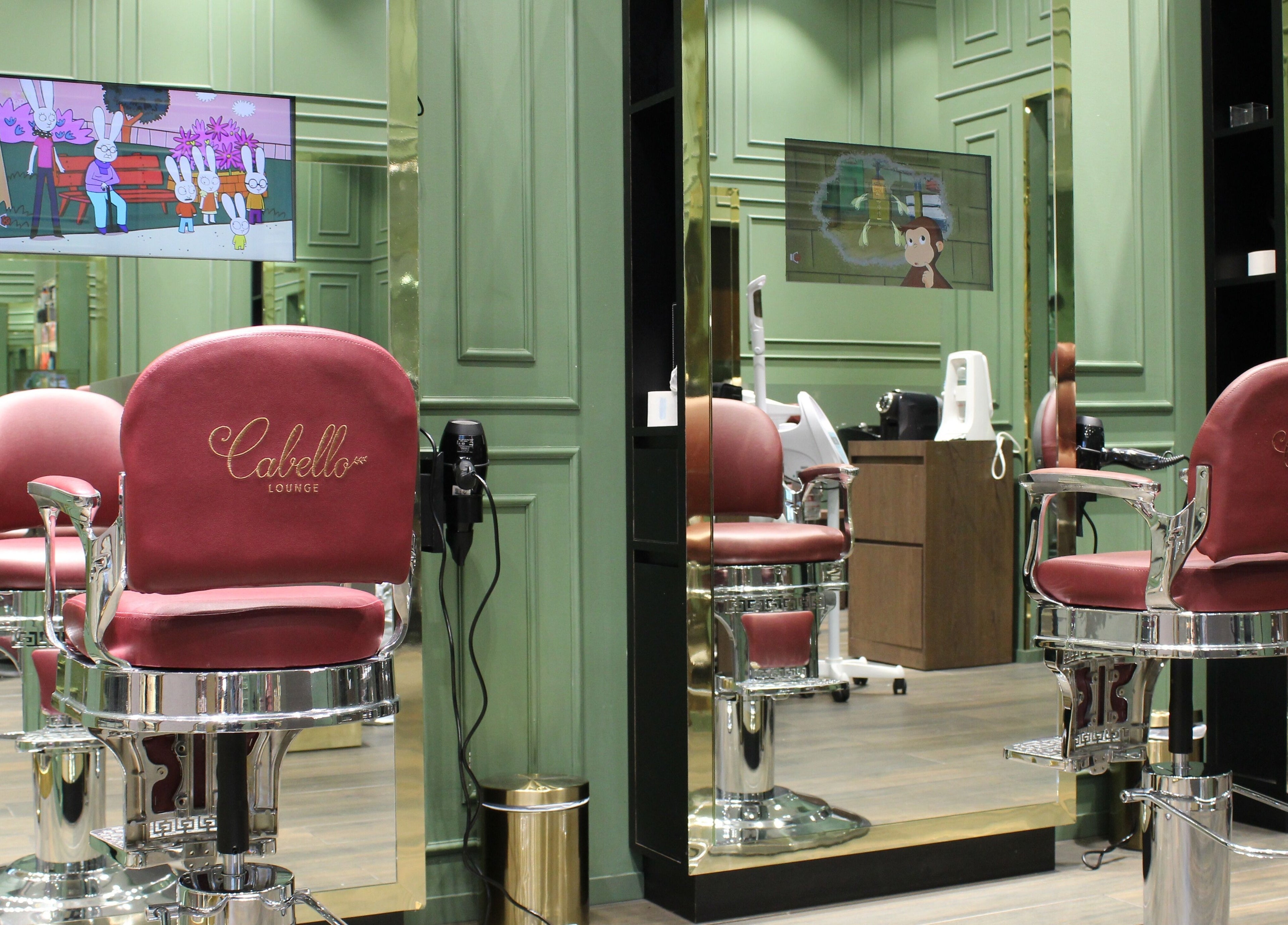 Elegant red barber chairs at Cabello Lounge - City Centre Mirdif, Dubai, Dubai, AE with stylish decor.