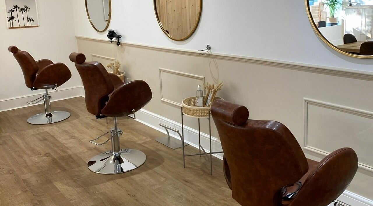 Elegant interior of Emily Kate Hair in Brigg, England, GB showcasing stylish salon chairs and mirrors.