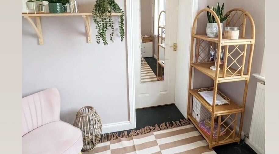 Relaxing interior of Nails by Hayley in Nairn, Scotland, GB featuring soft pink chair and natural decor.