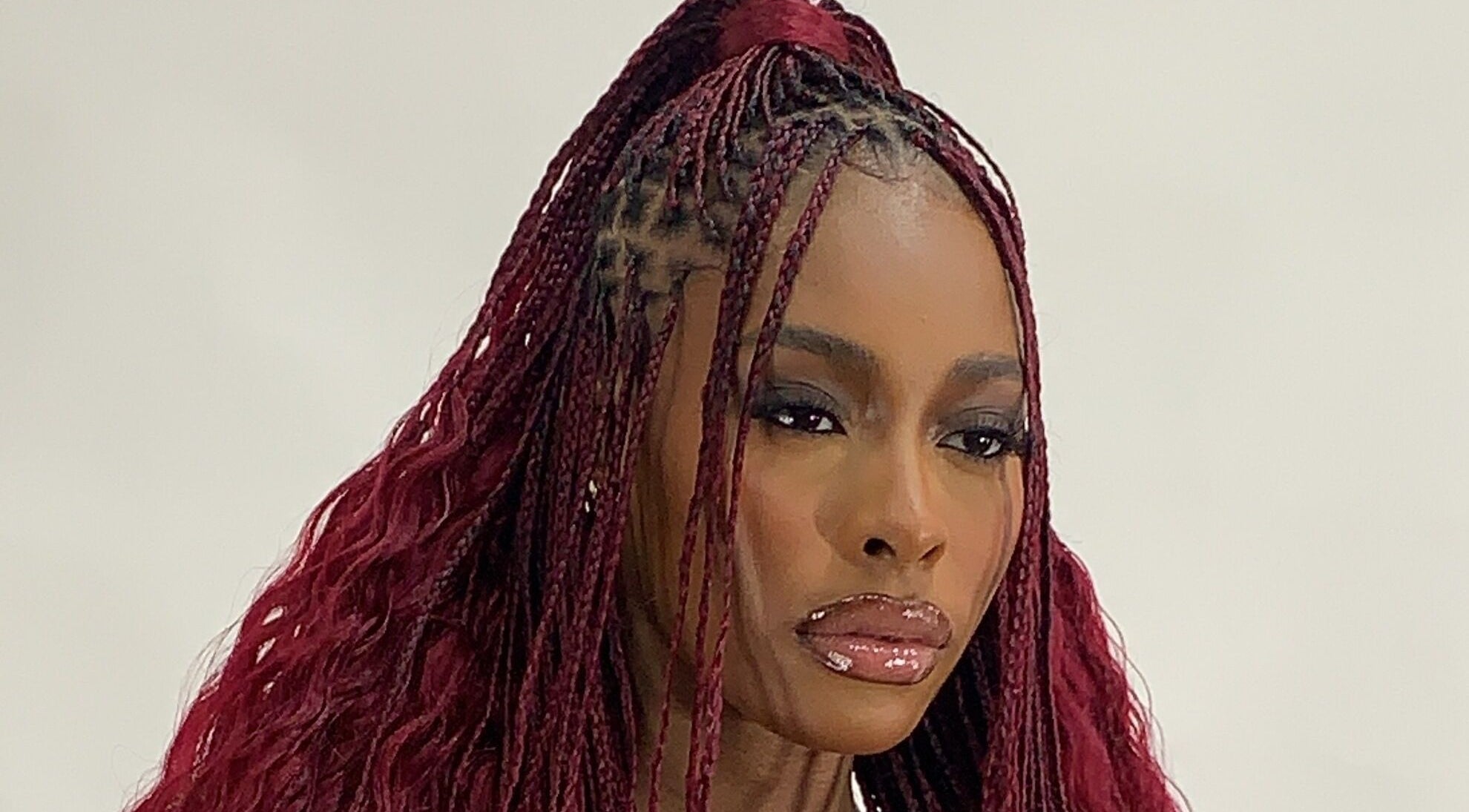 Elegant woman with braided hairstyle at Flawless Face by Jane, Lagos, Lagos, NG.