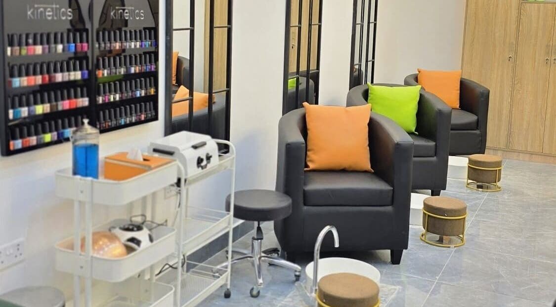 Elegant seating area at Ombre Tulip Beauty Salon LLC, Dubai, Dubai, AE, showcasing stylish nail polish collection.