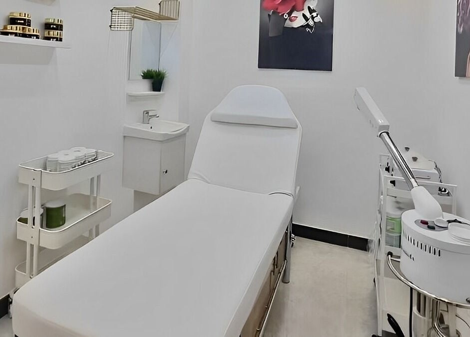Serene treatment room at Ombre Salon FZE, Dubai, AE, with spa bed and modern equipment.