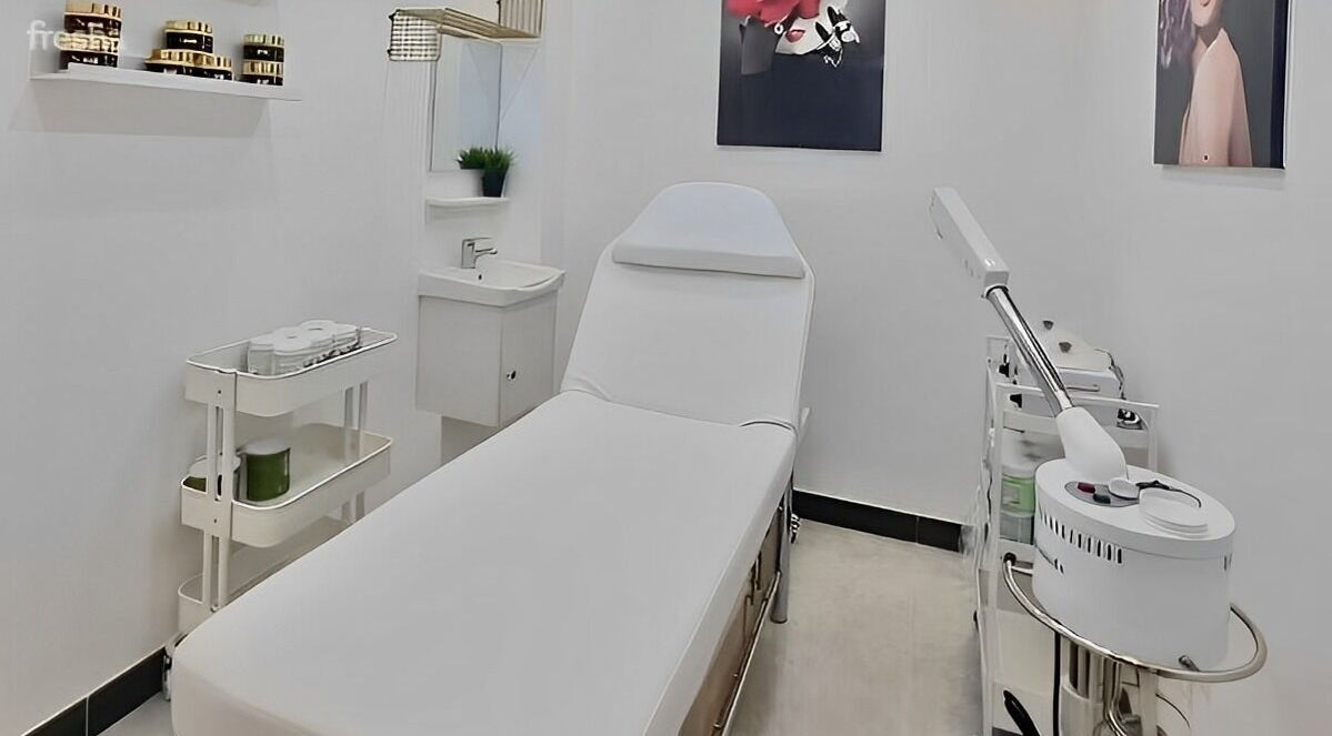 Serene treatment room at Ombre Salon FZE, Dubai, AE, with spa bed and modern equipment.